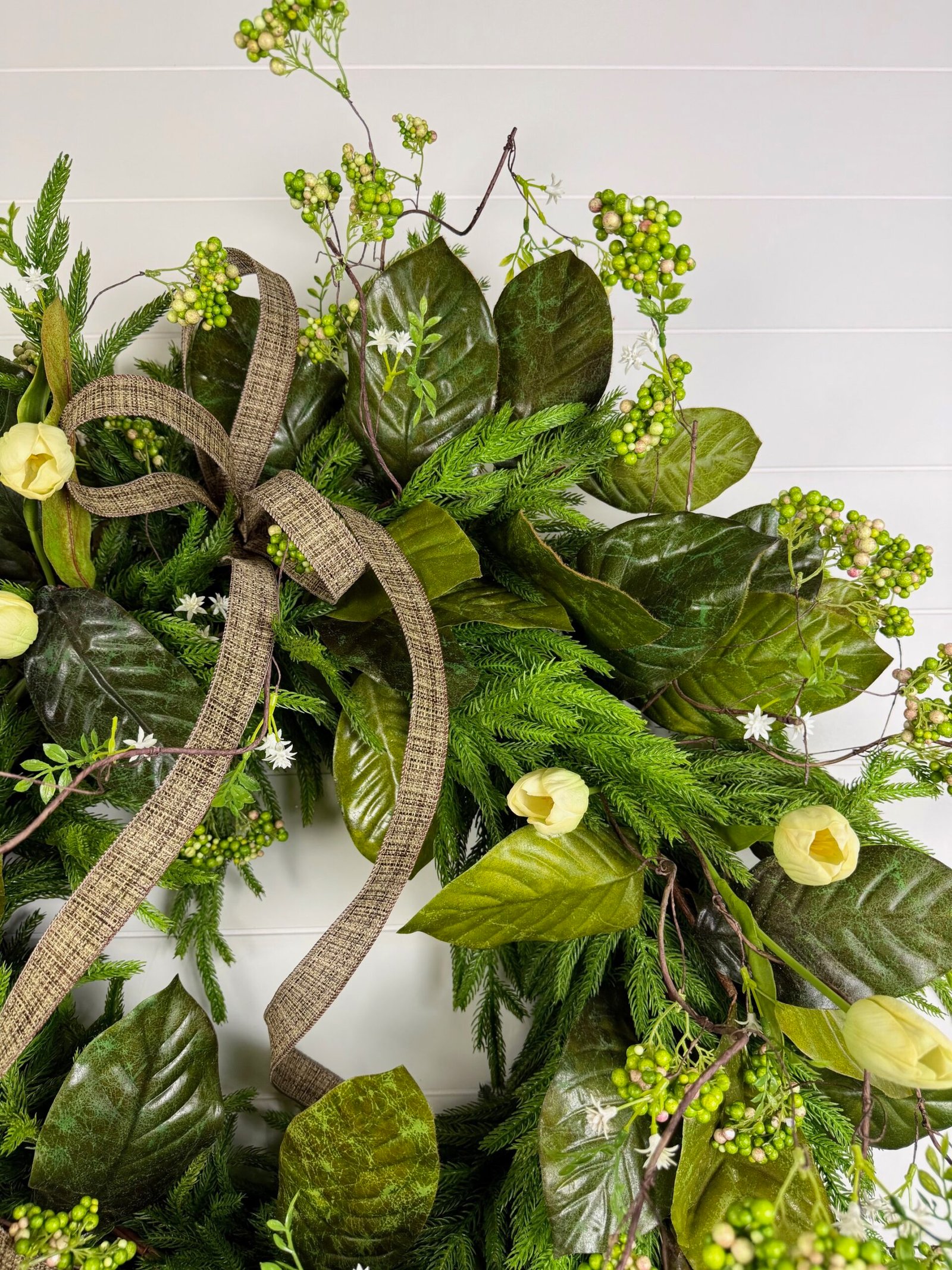 30" Green Magnolia Leaf & Norfolk Wreath w/Natural Touch Cream Tulips, Green Sedum Berries & Bow - Image 2